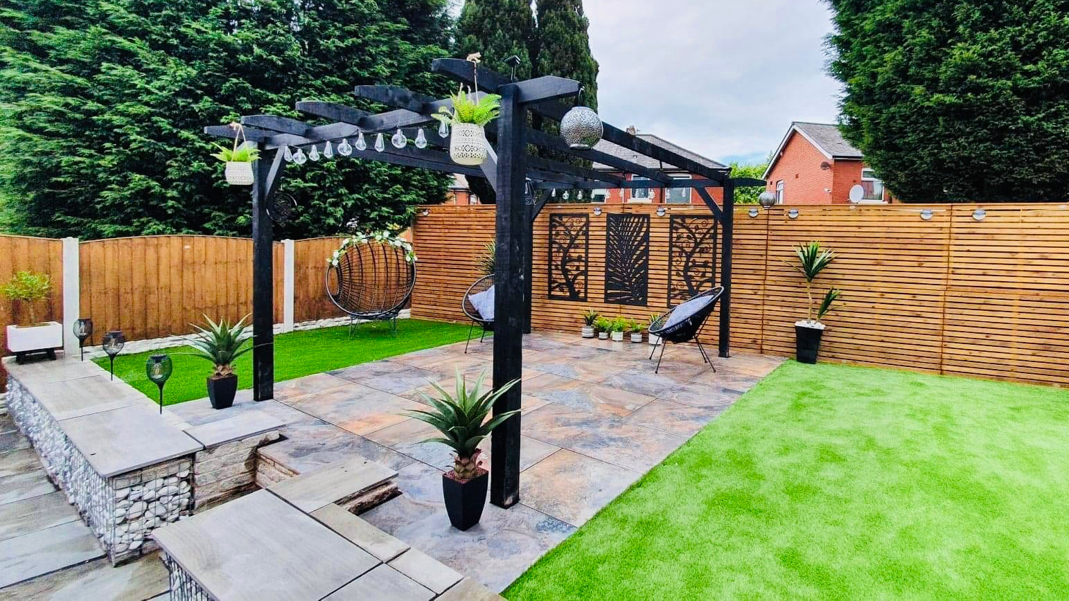 Pro Pave professional paving team carefully installing luxury patio in Manchester